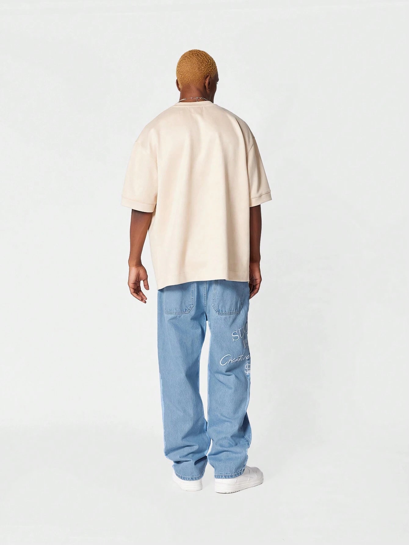 Calça Denim reta com bordado