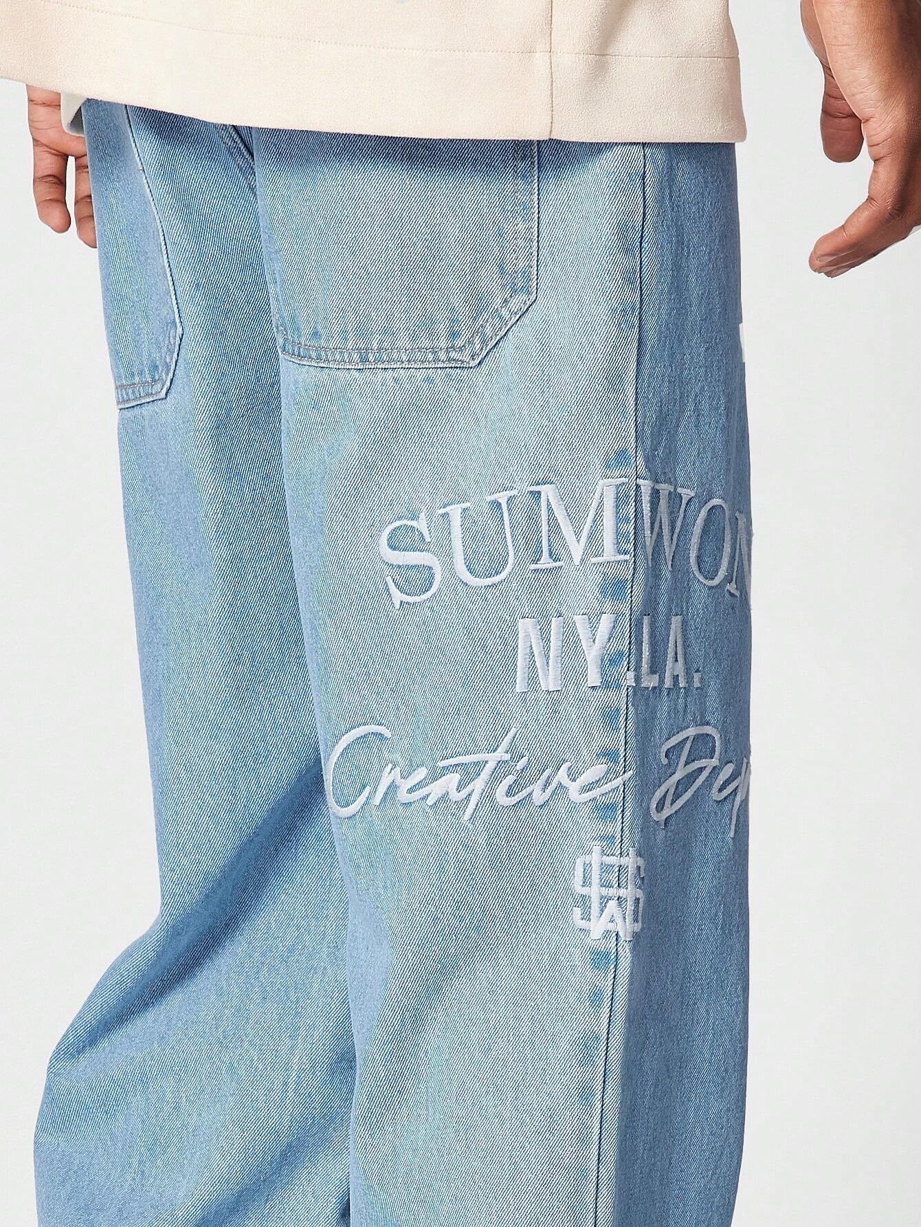 Calça Denim reta com bordado